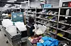 Workers prepare shipments for grocery delivery at a logistics facility in central Seoul on Feb. 9.