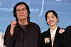 Korean auteur Lee Chang-dong, left, and actor Jeon Do-yeon pose for photograph during an event for film 'Possible Love' in Mapo District, western Seoul, on Aug. 25.