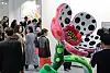Visitors view a bright polka-dotted floral sculpture at Frieze Seoul 2026 in Seoul.