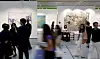Visitors walk among contemporary artworks and gallery booths at Frieze Seoul in Seoul.