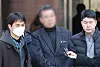 Director of Saekdongwon, a residential facility for people with developmental disabilities in Ganghwa, Incheon, center, is seen at Seoul Central District Court in Seocho District, southern Seoul, on Feb. 19.