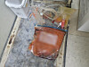 Discarded human fat is stored in a zipper storage bag instead of a designated medical waste container.