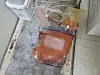 Discarded human fat is stored in a zipper storage bag instead of a designated medical waste container.