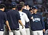 NC Dinos players and coaching staff react after winning a match against the Kia Tigers in Changwon, South Gyeongsang, on Sept. 2.
