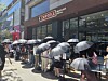 Black umbrellas and 150 hungry people: Seoul lines up for Chipotle opening