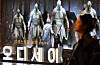 A person walks in front of promotional materials of  'The Odyssey' at a movie theater in Seoul on Sept. 6.