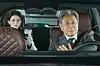 Han So-hee sits in the back seat as Choi Min-sik drives a luxury car in The Intern.