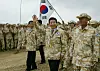 Then-President Roo Moo-hyun, center, visits northern Iraq where Korean forces were deployed on Dec. 8, 2004.