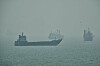 Commercial vessels anchored amid haze in the Strait of Hormuz off Bandar Abbas, Iran, on Sept. 7.