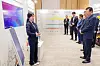 DO NOT RE USE!!! 재사용 금지!!!!!!! Lotte Chairman Shin Dong-bin, right, listens to a presentation on AI projects by young designers at Lotte World Tower in Songpa District, southern Seoul, on Sept 10.