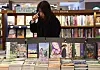 A person browses through a bookshelf at a bookstore in Seoul on Nov. 13, 2025.