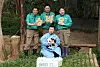 Shu Bao, the fourth giant panda born in Korea, is held by veteran zookeeper Kang Cheol-won during her first public appearance at Everland in Yongin, Gyeonggi, on Sept. 11. Other zookeepers hold up signs spelling out her name in Korean.
