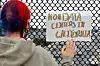 A woman displays a sign as demonstrators participate in nationwide protests against data centers, in Berkeley, California, on July 18.