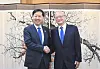Korean Finance Minister Koo Yun-cheol, left, shakes hands with President of the Asian Development Bank Masato Kanda at the central government complex in Seoul on Sept. 14.