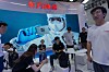 Visitors at the booth for Eastern Computing Chips a Chinese AI semiconductor company at the World AI Conference in Shanghai on July 17.