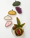 Key rings modeled after half-moon shaped rice cake