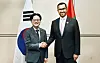 Korea's Industry Minister Kim Jung-kwan, left, shakes hands with his counterpart Sultan Al Jaber of the United Arab Emirates in central Seoul on July 8.