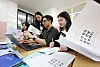 Students and teachers browse through instructions before submitting college entrance applications for the admissions for the 2027 academic year in a high school in Gyeonggi on Sept. 7.
