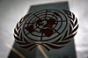 FILE PHOTO: The United Nations headquarters building is pictured though a window with the UN logo in the foreground in the Manhattan borough of New York August 15, 2014. REUTERS/Carlo Allegri/File Photo/2024-10-24 07:06:12/