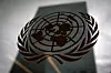 FILE PHOTO: The United Nations headquarters building is pictured though a window with the UN logo in the foreground in the Manhattan borough of New York August 15, 2014. REUTERS/Carlo Allegri/File Photo/2024-10-24 07:06:12/