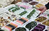 A consumer picks a package of eight songpyeon (half-moon-shaped rice cake) at Mangwon Market in western Seoul on Feb. 11.