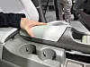A hidden armrest tray beside the driver's seat adds discreet storage.