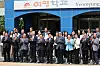 Officials and representatives pose for a photo after a signing ceremony to build a new building for Yeomyung School — an alternative school dedicated to educating North Korean defector youth and children from North Korean backgrounds — in Gangseo District, western Seoul, on July 24.