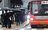 An intercity bus connecting Gyeonggi and Seoul arrives at a bus stop in central Seoul on Feb. 5, 2024. The bus displays a sign prohibiting standing passengers.