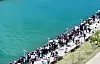 People gather at North Port Waterfront Park to see a shark in Busan, on Sept. 20.