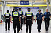 Police officers patrol inside a subway station in Gyeonggi on Aug. 4, 2023, after a series of bomb threats.