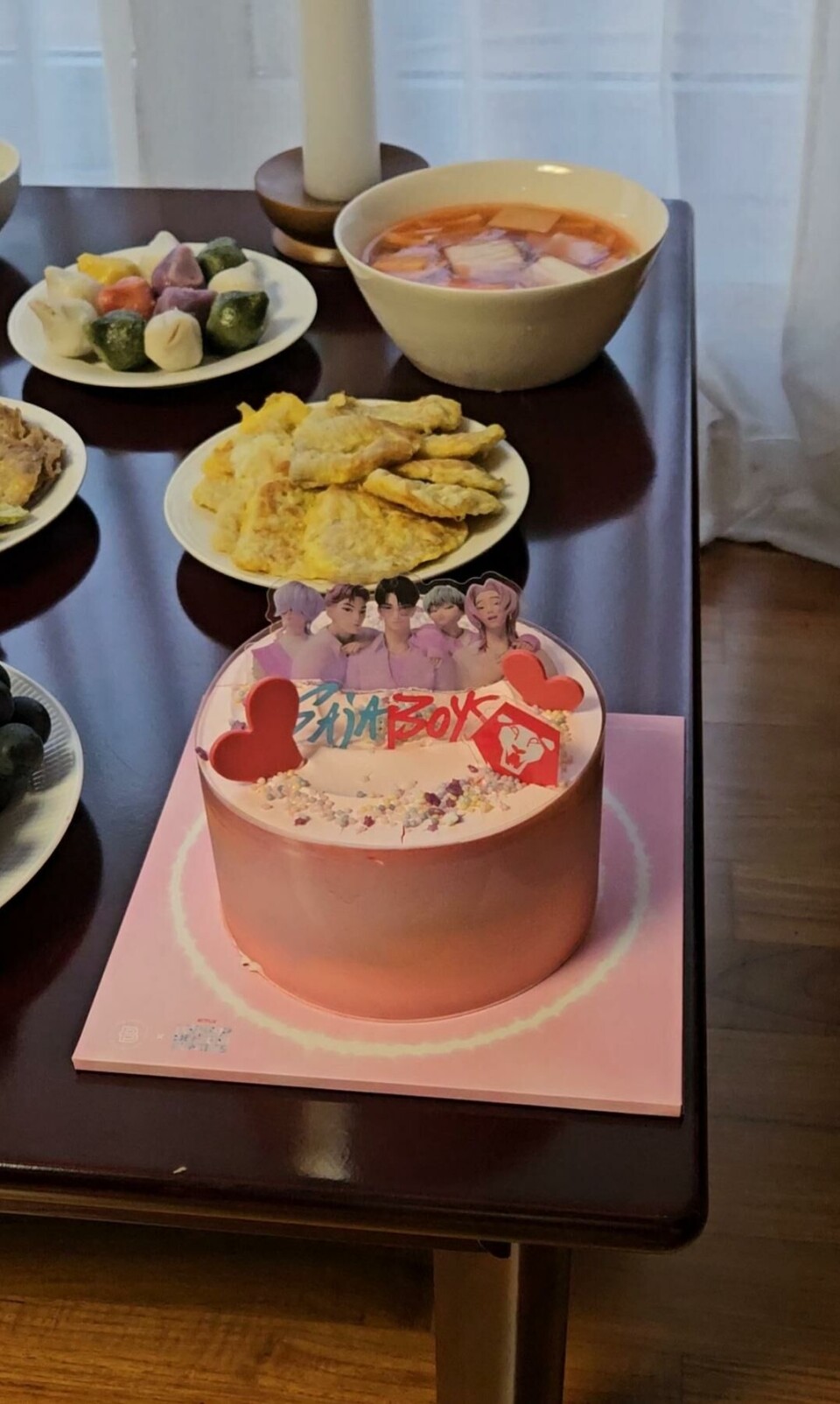 A Chuseok ancestral rite table featuring a cake inspired by KPop Demon Hunters