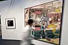 Visitors view a colorful contemporary painting in a white-walled gallery at Frieze Seoul.