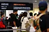 Visitors queue for tickets beneath bilingual signs at MMCA Seoul.