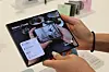 A person holds a Galaxy Z Fold8 device in a Samsung store in western Seoul on July 28.