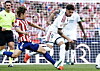 Lee Kang-in of Atlético Madrid, left, makes a hard tackle on Federico Valverde’s ankle during a match on Sept. 20 at Riyadh Air Metropolitano stadium in Madrid.
