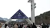 Newly enrolled Seoul National University students and their families walk near the campus main entrance in Gwanak District, southern Seoul.