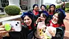 International students pose for a photo in graduation gowns after a commencement ceremony at Keimyung University’s Seongseo Campus in Dalseo District, Daegu.