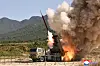 KCNA photo of the upgraded 240mm guided multiple rocket launcher test-firing