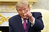 Donald Trump points toward the camera during a White House meeting with Xi Jinping.