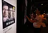 A moviegoer purchases a ticket as a digital poster for “The Assassin(s)' is appeared on a screen at a movie theater in Seoul on Sept. 28.