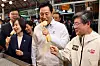 Seoul Mayor Oh Se-hoon, second from right, eats food at a vendor at a traditional market in central Seoul on Sept. 22.