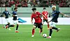 Korea's winger Kim Min-su, center, competes for a ball during an international match against Uruguay at Seoul World Cup Stadium in western Seoul on Sept. 28.