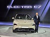Electra E7 electric vehicle displayed onstage beside a presenter.