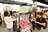 Foreign visitors shop Korean beauty products at a cosmetic store in Seoul on Sept. 20.