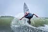 Kanoa Hee-jae Palmiano rides a wave on his surfboard in a photo provided by the Korea Surfing Association.