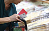 A person holds Onnuri gift certificates at a traditional market in Mapo District, western Seoul, on Sept. 12, 2024.