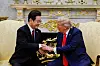 Korean President Lee Jae Myung, left, shakes hands with U.S. President Donald Trump at the Oval Office, at the White House, in Washington, D.C., on Aug. 25, 2025.