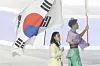 Korea's climber Seo Chae-hyun carries the Korean national flag at the closing ceremony of the Asian Games Aichi-Nagoya 2026 on Oct. 4.