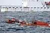 A 29-ton fishing boat lies capsized about 65 kilometers (40 miles) northwest of Chagwi Island, Jeju, on Monday.