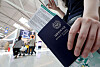 A traveler shows their Korean passport at Incheon International Airport Terminal 1 on July 1, 2024.